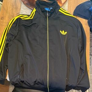 Adidas Men's Black Windbreaker with Yellow Stripes